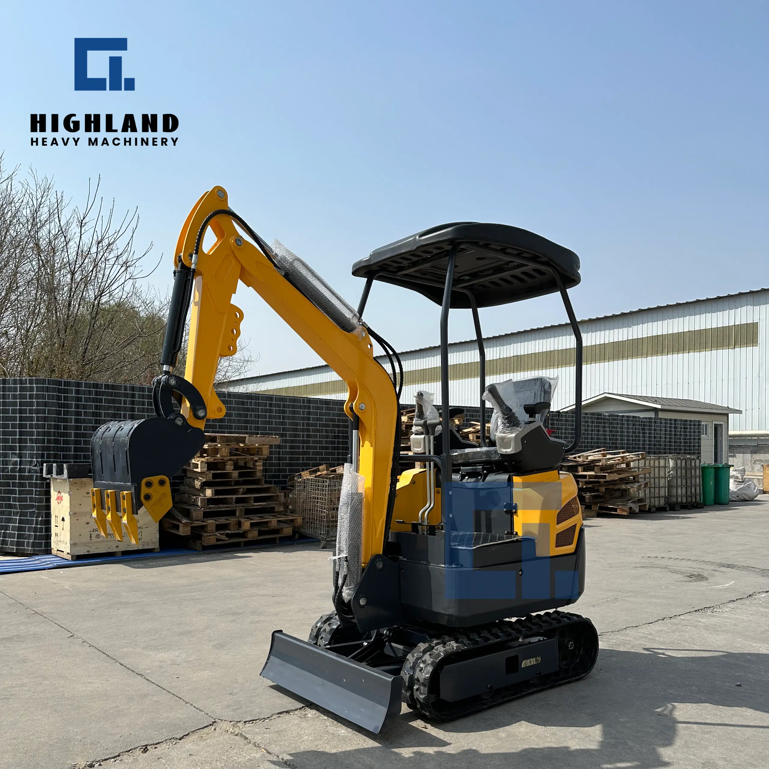 HIGHLAND HEAVY MACHINERY HIW 16 mini excavator with dozer blade and canopy, parked outdoors in a factory yard, compact 1.6-ton machine for landscaping, trenching, and small-scale earthmoving projects