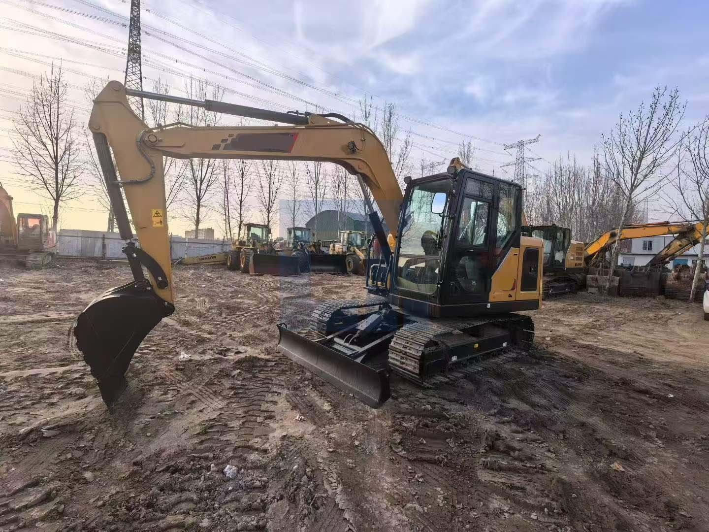 Yellow crawler excavator working on construction site by HIGHLAND HEAVY MACHINERY
