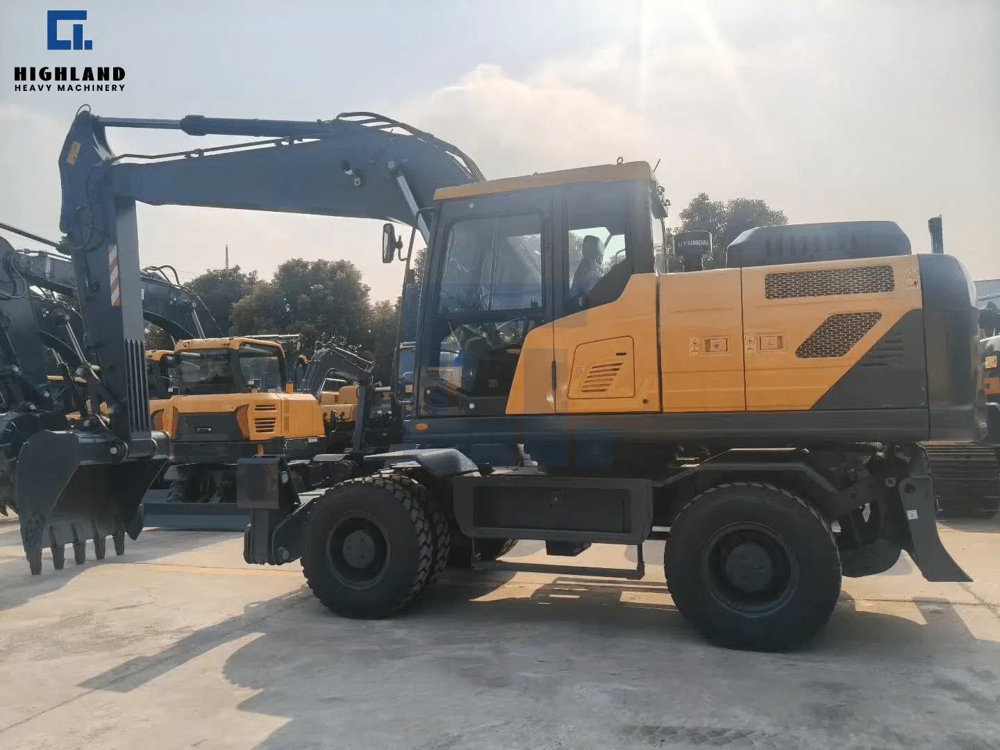 International top brand wheeled excavator with mobile chassis and operator cabin, now available through HIGHLAND HEAVY MACHINERY for urban construction and road maintenance projects