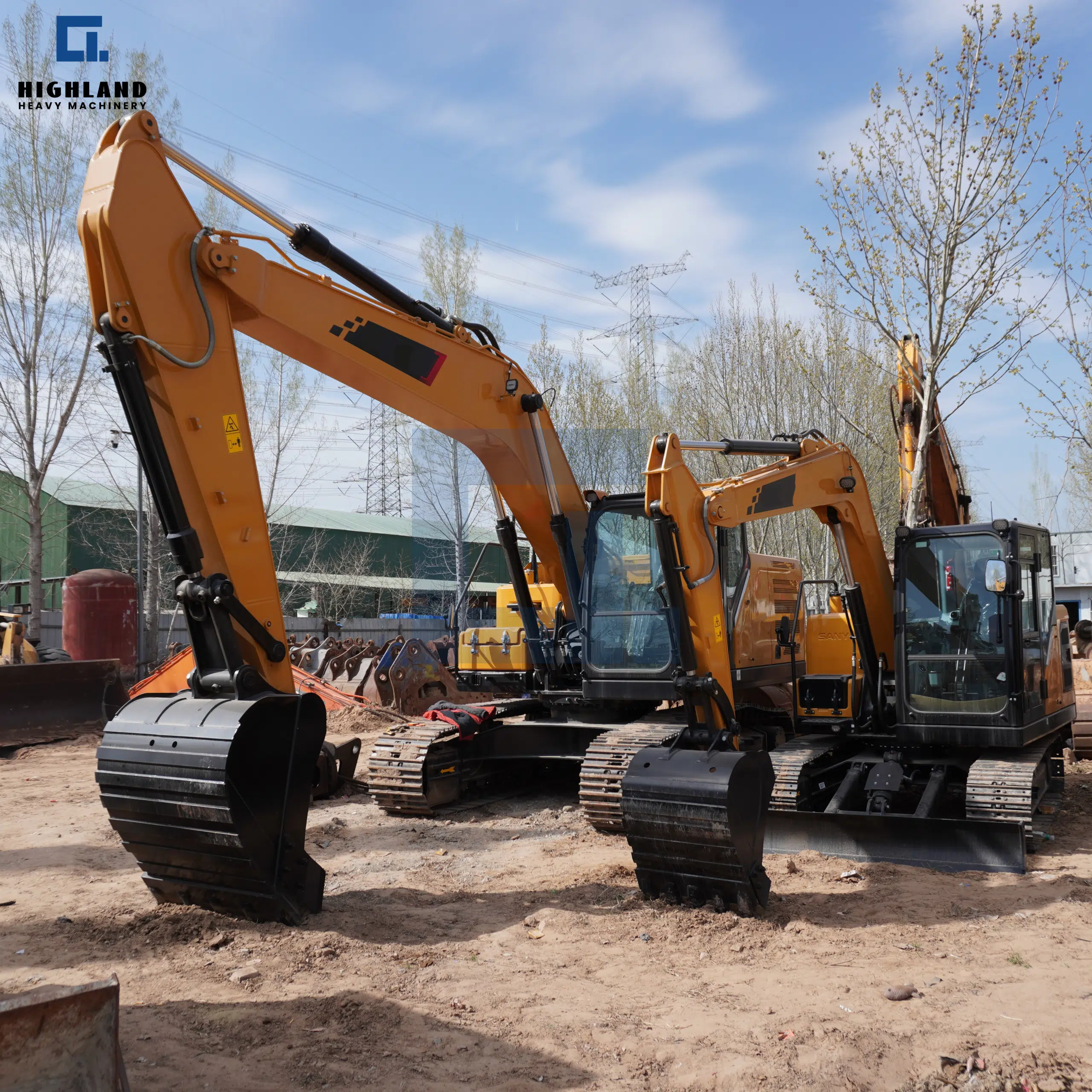Multiple crawler excavators lined up at work site, now available through HIGHLAND HEAVY MACHINERY for immediate deployment on large-scale construction and earthmoving projects