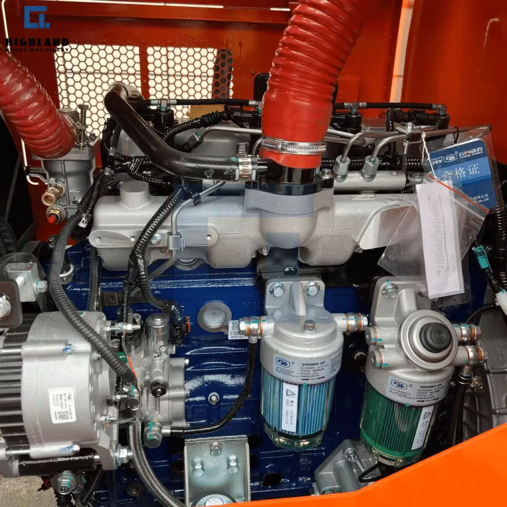 HIGHLAND HEAVY MACHINERY 5t articulated rough terrain forklift for mining engine compartment close-up, featuring a heavy-duty blue engine block, reinforced red braided air intake hoses, and advanced dual fuel filtration system designed for extreme off-road reliability.